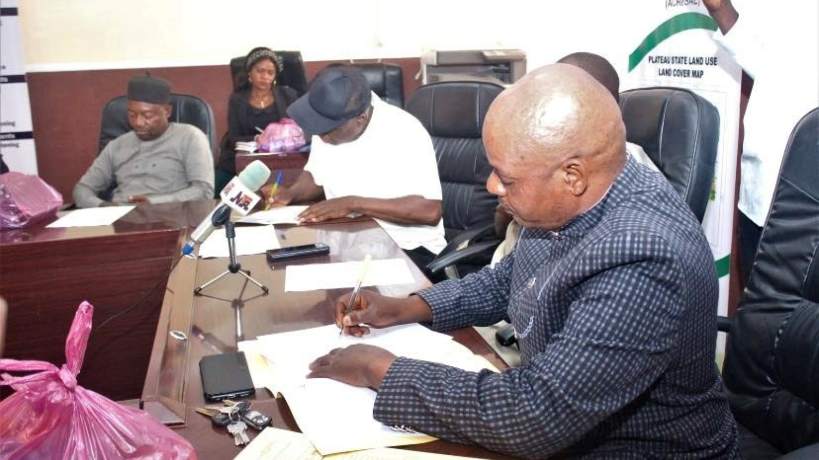 JFirst right, Mr. Garba Gowon Gonkol, ACReSAL State Project Coordinator, Plateau state signing the contract document on behalf of Governor Caleb Mutfwang